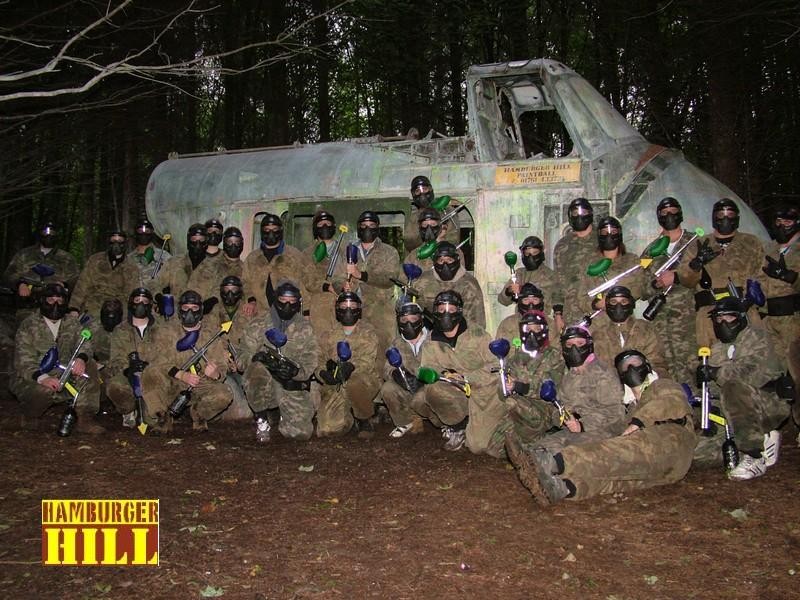 A Paintballing group photographed in front of our Skiworksi Helicopter